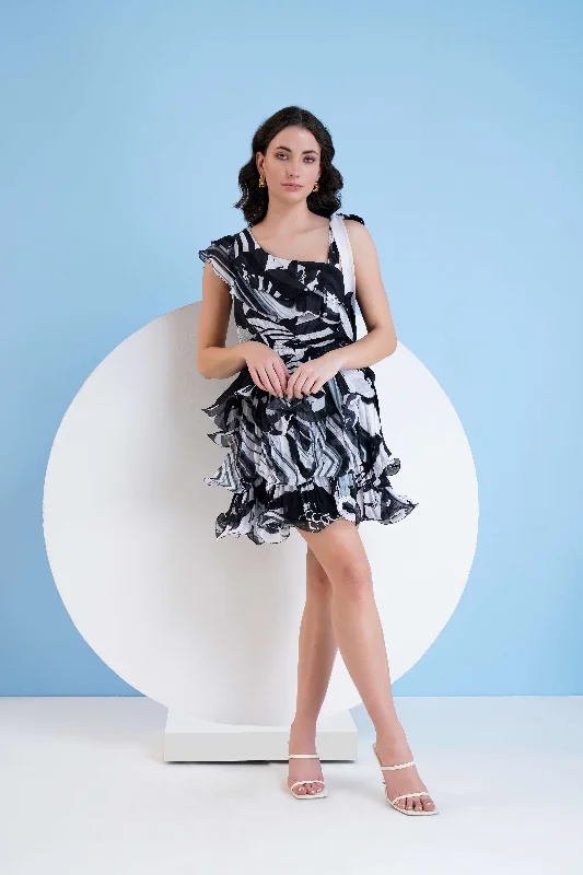 BLACK PRINTED TIERED DRESS WITH CASCADE DETAIL